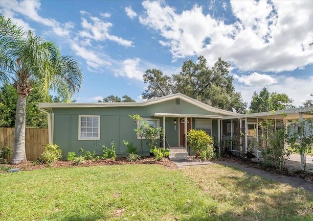 single story home featuring a front yard