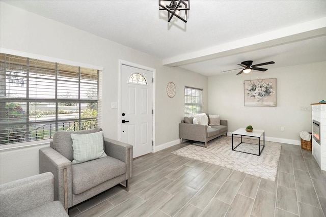 living room with light hardwood / wood-style flooring and ceiling fan