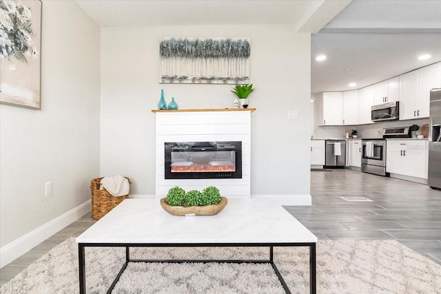 living room with dark hardwood / wood-style floors