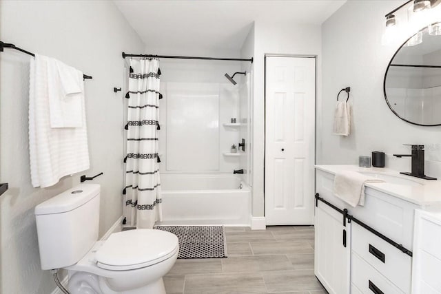 full bathroom featuring toilet, shower / bath combo with shower curtain, and vanity