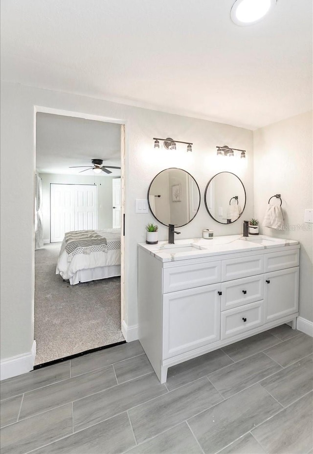 bathroom featuring vanity and ceiling fan