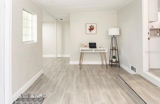 office with light hardwood / wood-style flooring