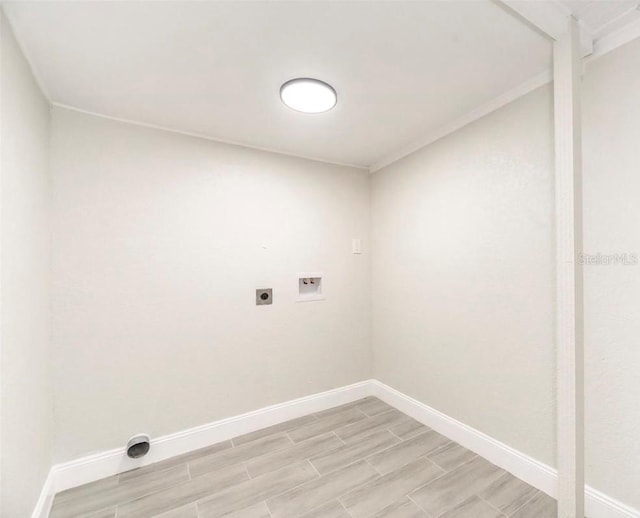 laundry room with hookup for an electric dryer, hookup for a washing machine, and light wood-type flooring