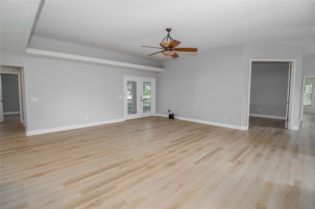 spare room with light hardwood / wood-style floors, french doors, and ceiling fan