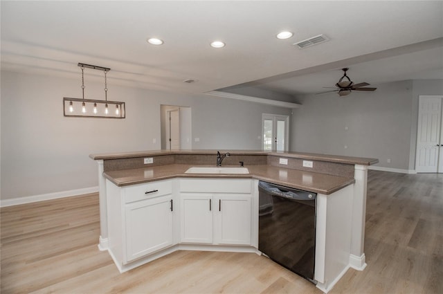 kitchen featuring white cabinetry, light hardwood / wood-style flooring, dishwasher, and sink