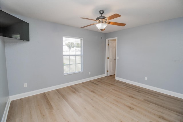 spare room with light hardwood / wood-style floors and ceiling fan