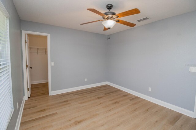 spare room with light hardwood / wood-style floors and ceiling fan