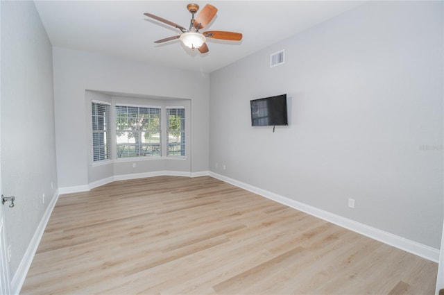 unfurnished room with light hardwood / wood-style floors and ceiling fan