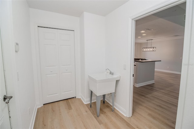300 Winona Ct, Auburndale, FL 33823 - hall with light wood finished floors, baseboards, and recessed lighting
