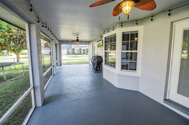 300 Winona Ct, Auburndale, FL 33823 - unfurnished sunroom featuring ceiling fan and rail lighting