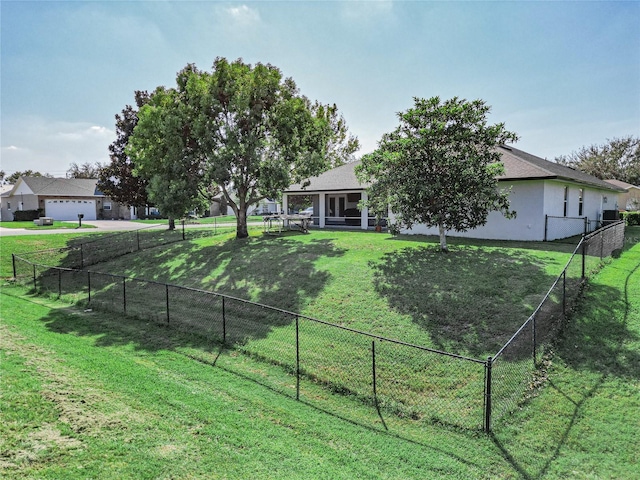 view of yard with a garage