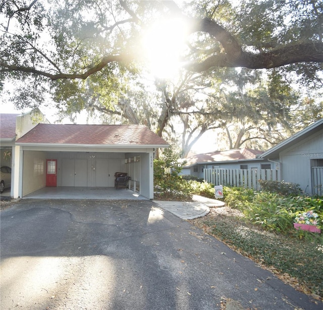 view of side of home featuring a garage