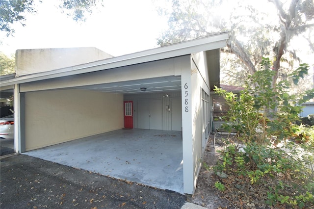 garage featuring a carport