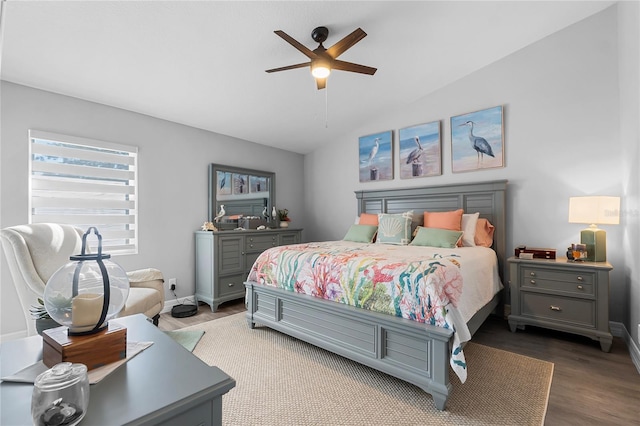 bedroom featuring ceiling fan, wood-type flooring, and vaulted ceiling