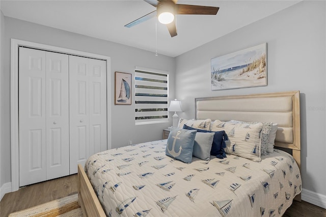 bedroom with a closet, dark wood-type flooring, and ceiling fan