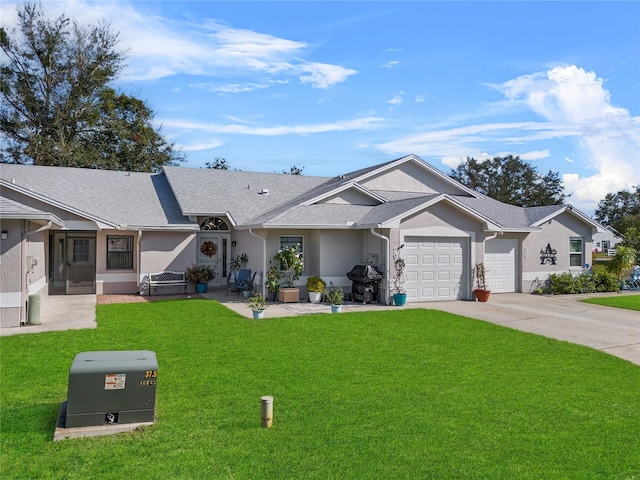 single story home with a front yard and a garage