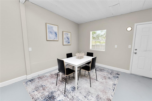 dining space with concrete flooring