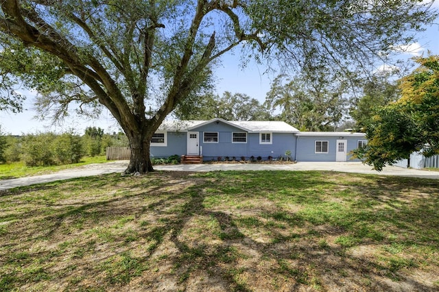 ranch-style house with a front lawn