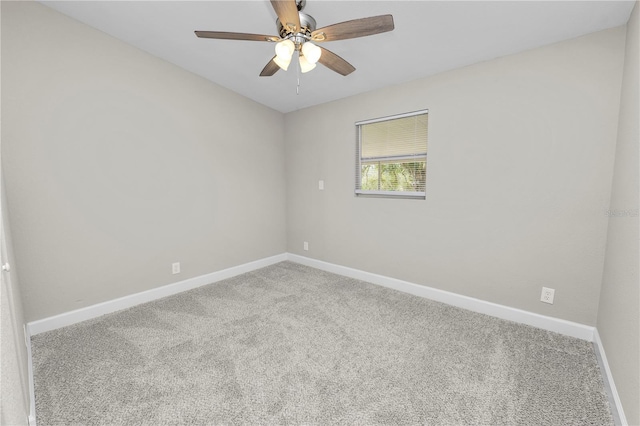 empty room with ceiling fan and carpet