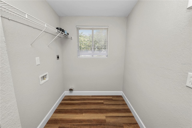 washroom with electric dryer hookup, washer hookup, and dark wood-type flooring