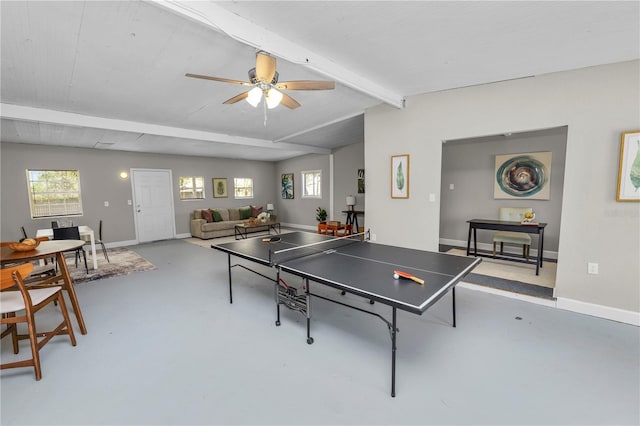 recreation room with ceiling fan and beam ceiling