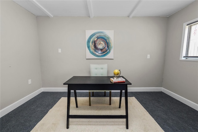 home office with beam ceiling and dark colored carpet