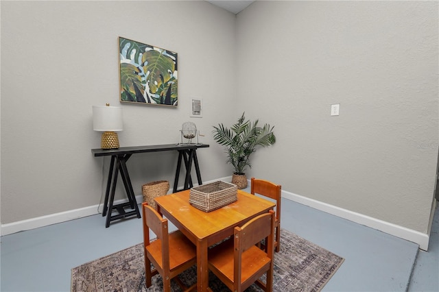 dining room featuring concrete floors