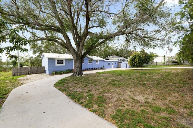 ranch-style house with a front lawn