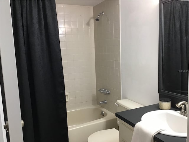 full bathroom with vanity, shower / tub combo with curtain, and toilet