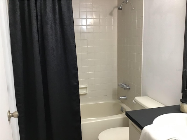 full bathroom with vanity, shower / bath combination with curtain, and toilet