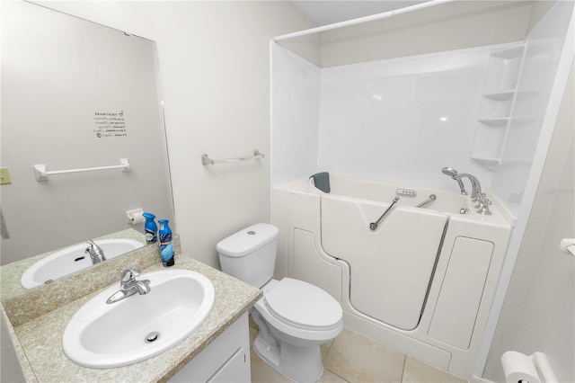 full bathroom featuring toilet, vanity, tile patterned floors, and separate shower and tub