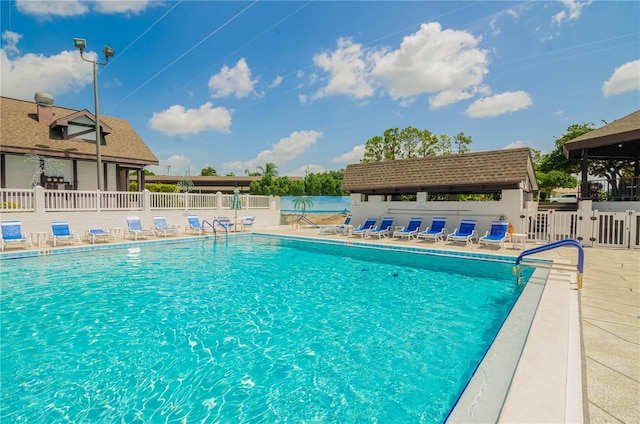 view of swimming pool with a patio