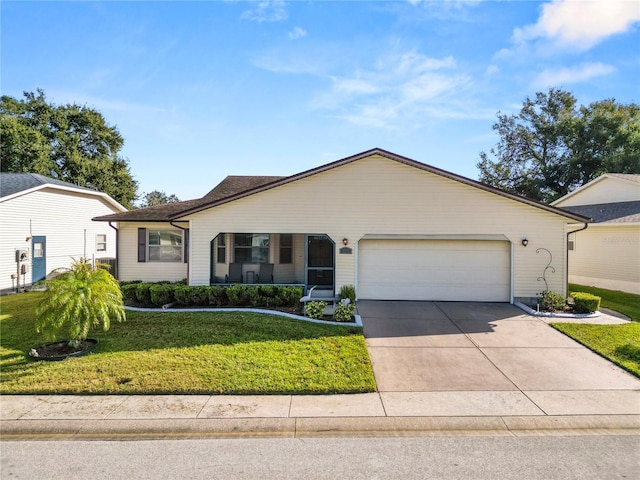 ranch-style home featuring a front lawn and a garage