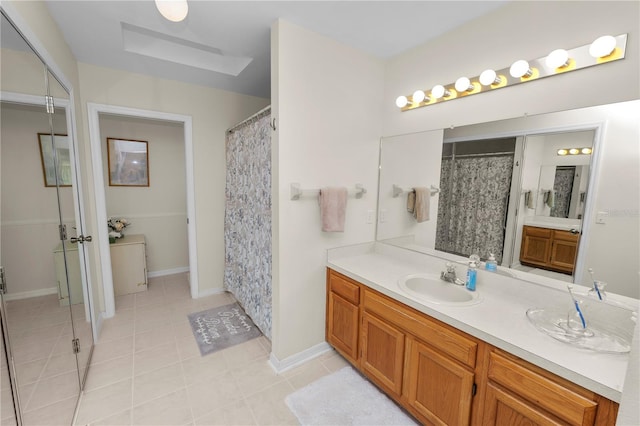 bathroom with vanity, tile patterned floors, and a shower with curtain