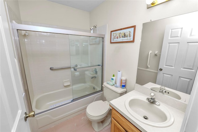 full bathroom featuring toilet, vanity, shower / bath combination with glass door, and tile patterned flooring