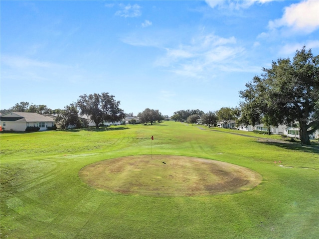 surrounding community featuring a lawn