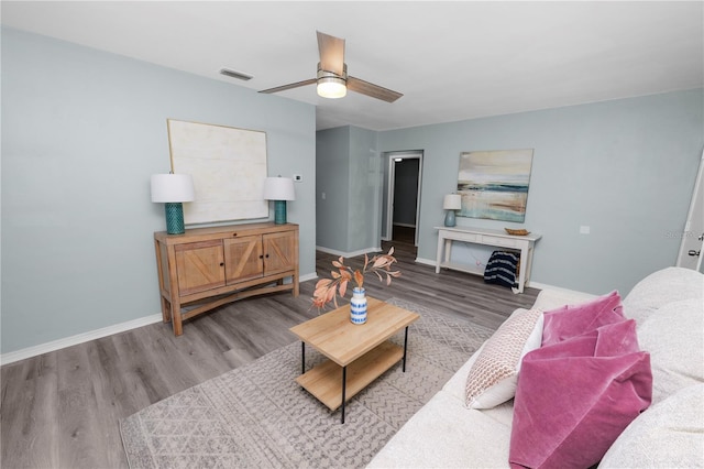 living room with ceiling fan and hardwood / wood-style floors