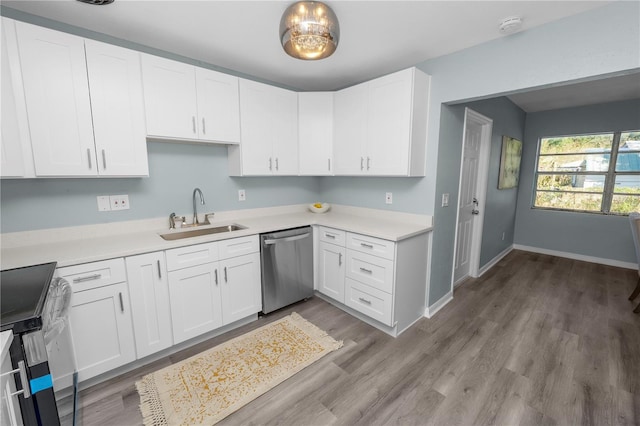 kitchen featuring white cabinetry, light hardwood / wood-style flooring, sink, and stainless steel dishwasher