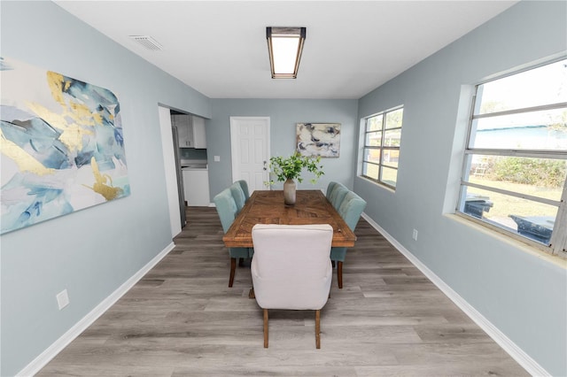 dining area with light wood-type flooring