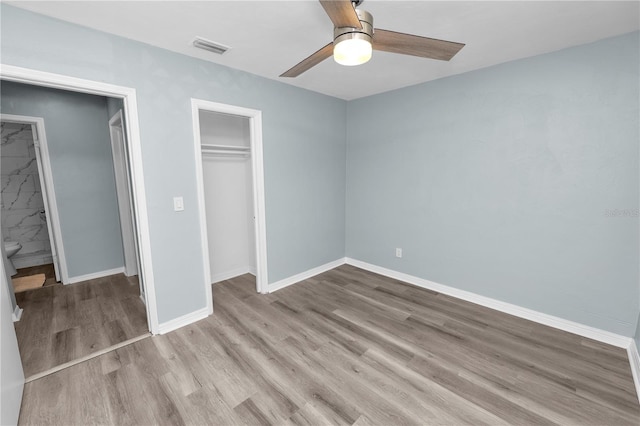 unfurnished bedroom featuring light hardwood / wood-style floors and ceiling fan