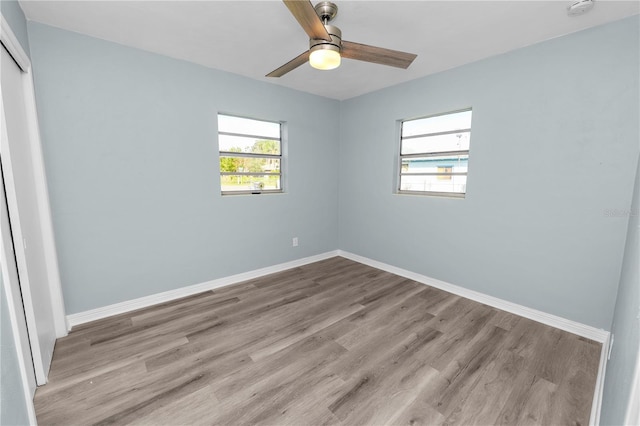 unfurnished bedroom with light hardwood / wood-style floors and ceiling fan