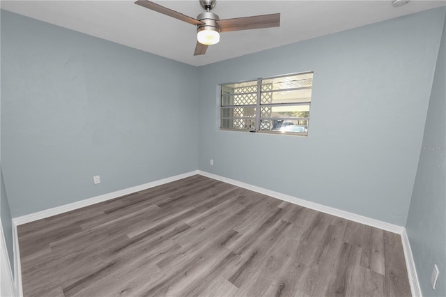 unfurnished room with light wood-type flooring and ceiling fan