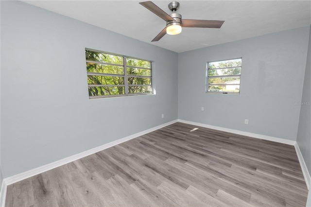 1220 Woodland Ave, Lakeland, FL 33801 - spare room with plenty of natural light, wood finished floors, and a ceiling fan