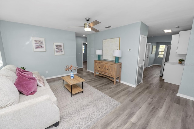 1220 Woodland Ave, Lakeland, FL 33801 - living room featuring wood finished floors and ceiling fan