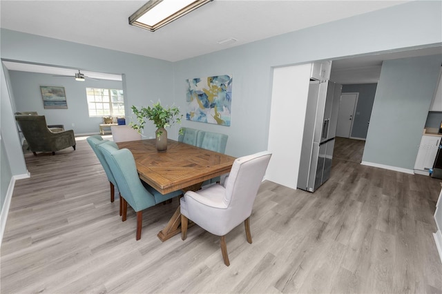 1220 Woodland Ave, Lakeland, FL 33801 - dining space with light wood-type flooring and baseboards
