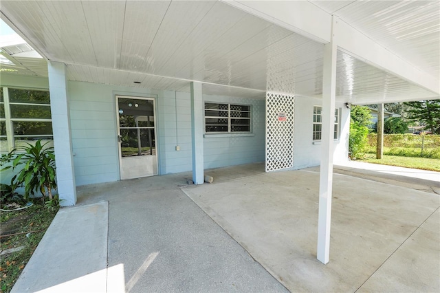 1220 Woodland Ave, Lakeland, FL 33801 - view of patio featuring an attached carport