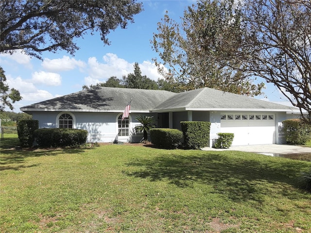 single story home with a front lawn and a garage