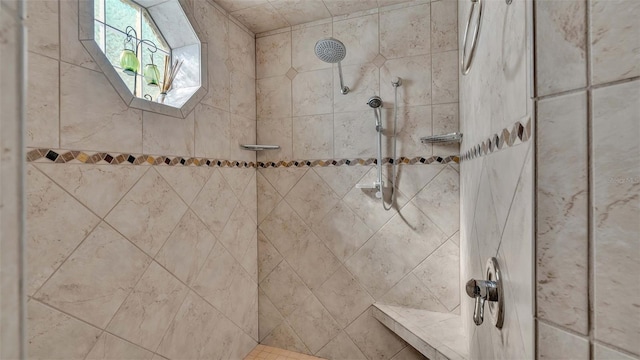 bathroom with tiled shower