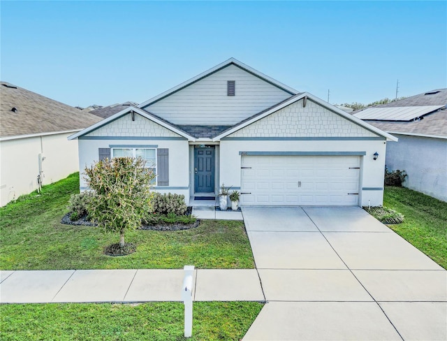 ranch-style home with a front lawn and a garage