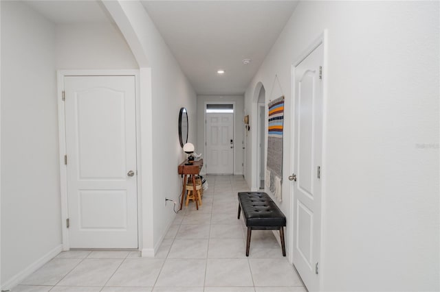 hallway featuring light tile patterned flooring